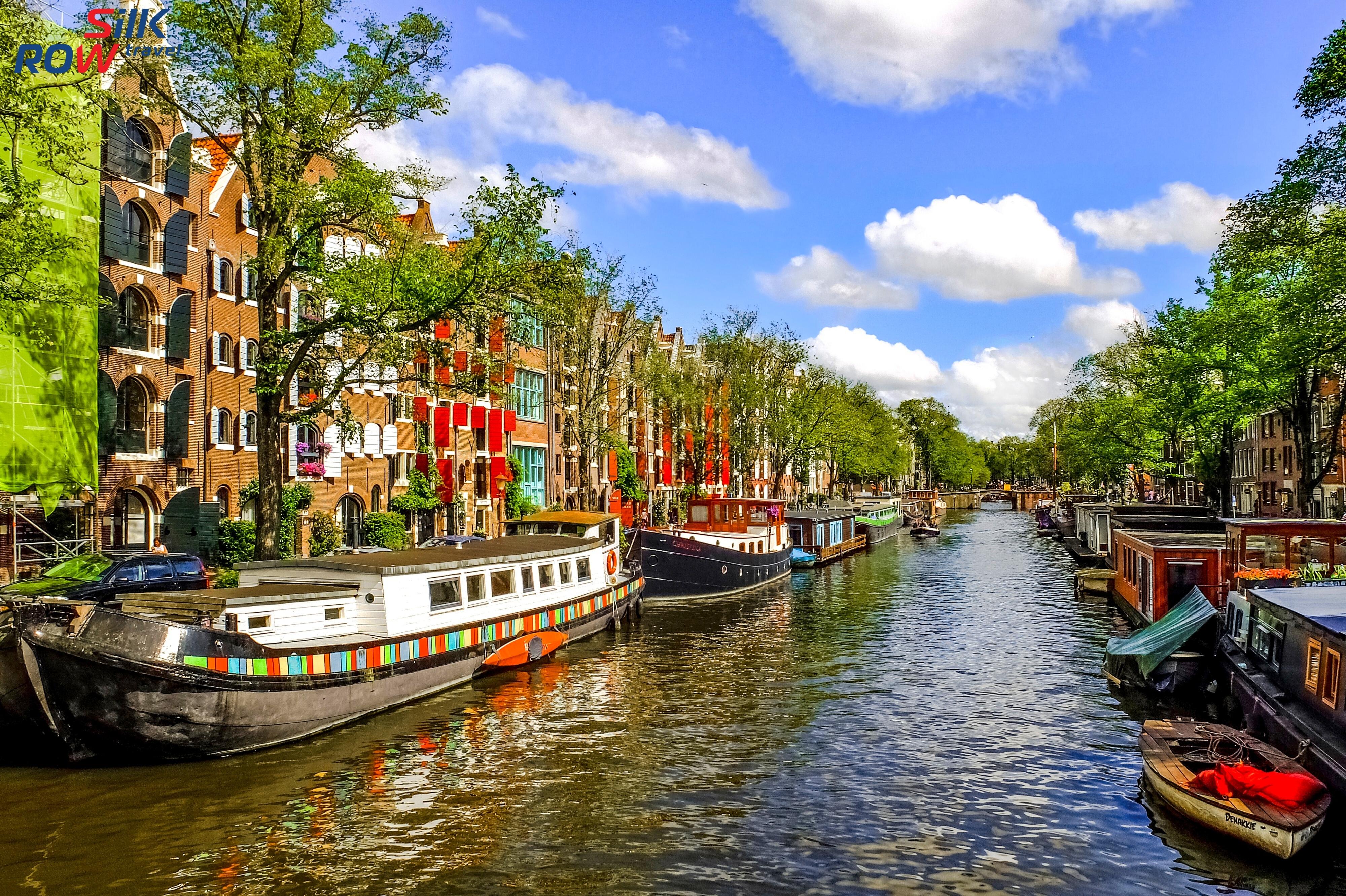 Amsterdam. Канал кейзерсграхт Амстердам. Нидерланды каналы Амстердама. Голландия Амстердам достопримечательности. Водные каналы Голландии.